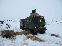 Hagglund BV206 delivering animal feed in the snow - click to enlarge