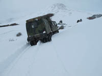 Hagglund BV206 delivering animal feed in the snow - click to enlarge