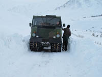 Hagglund BV206 delivering animal feed in the snow - click to enlarge