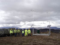 Hagglund BV206 at comms mast installation site with the installation team - click to enlarge